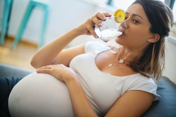 pregnant woman drinking water 