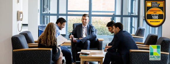 business students gathering around