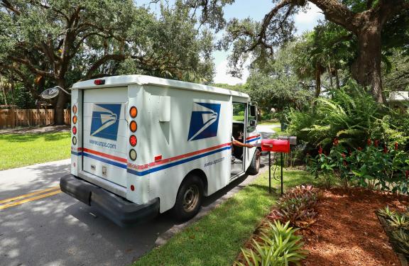 USPS truck delivering mail