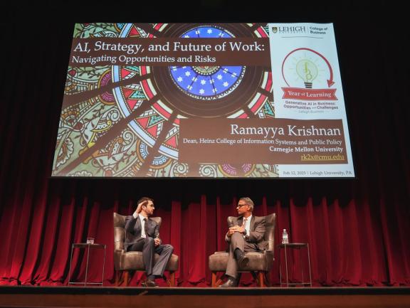 Burak Eskici, a teaching assistant professor in Lehigh College of Business' DATA Department, and featured speaker Ramayya Krishnan, right, at the 2025 Year of Learning lecture.