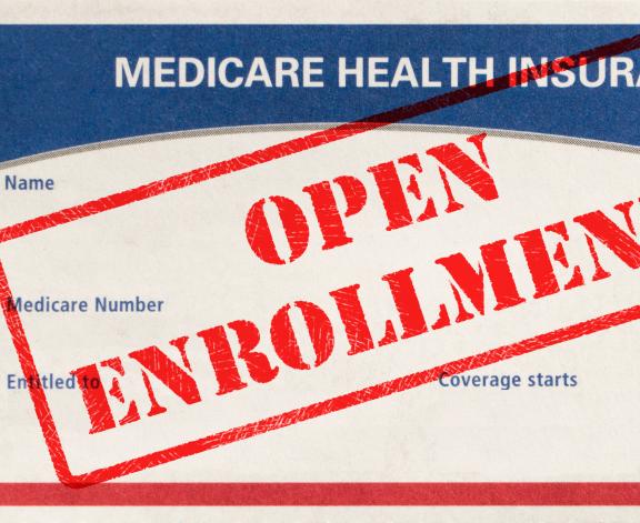 Medicare card with open enrollment stamp