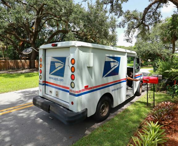 USPS truck delivering mail