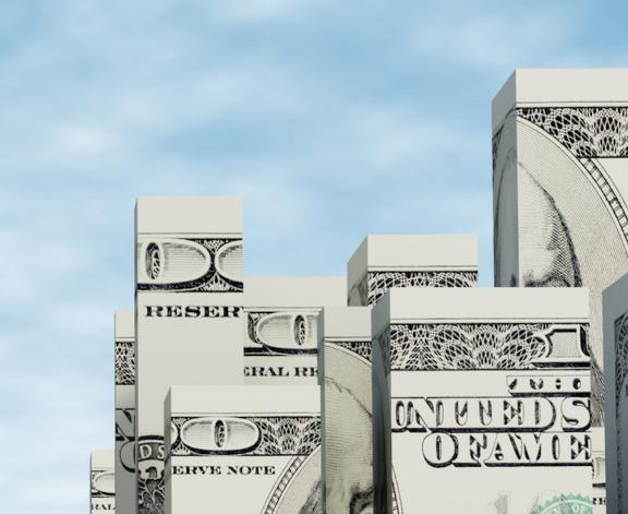 dollar bills in the shape of skyscrapers