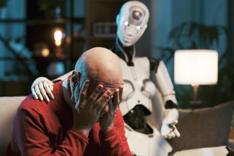 image of a robot and a human