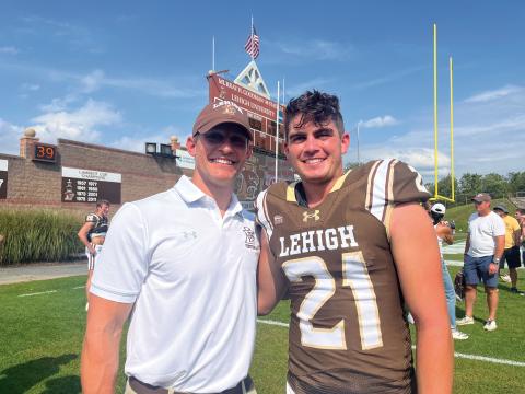 Coach Eric Markovcy and Canaan Kimball at a Lehigh football game