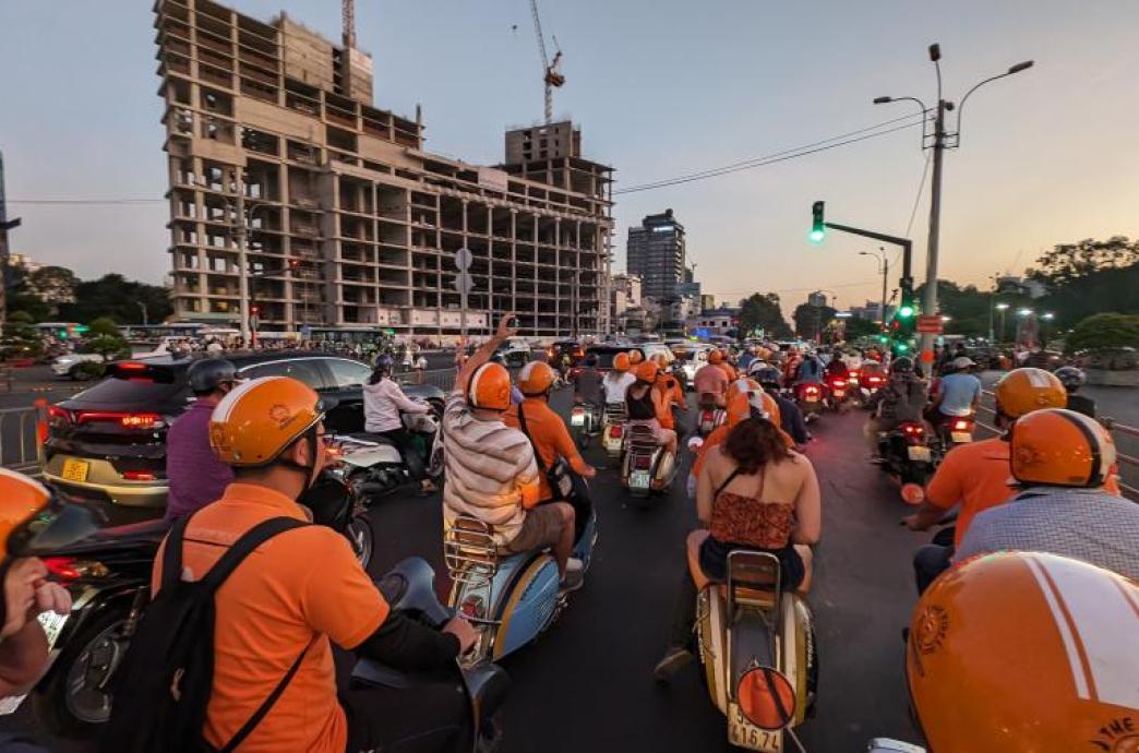 Students riding motorbikes through Ho Chi Minh City. 