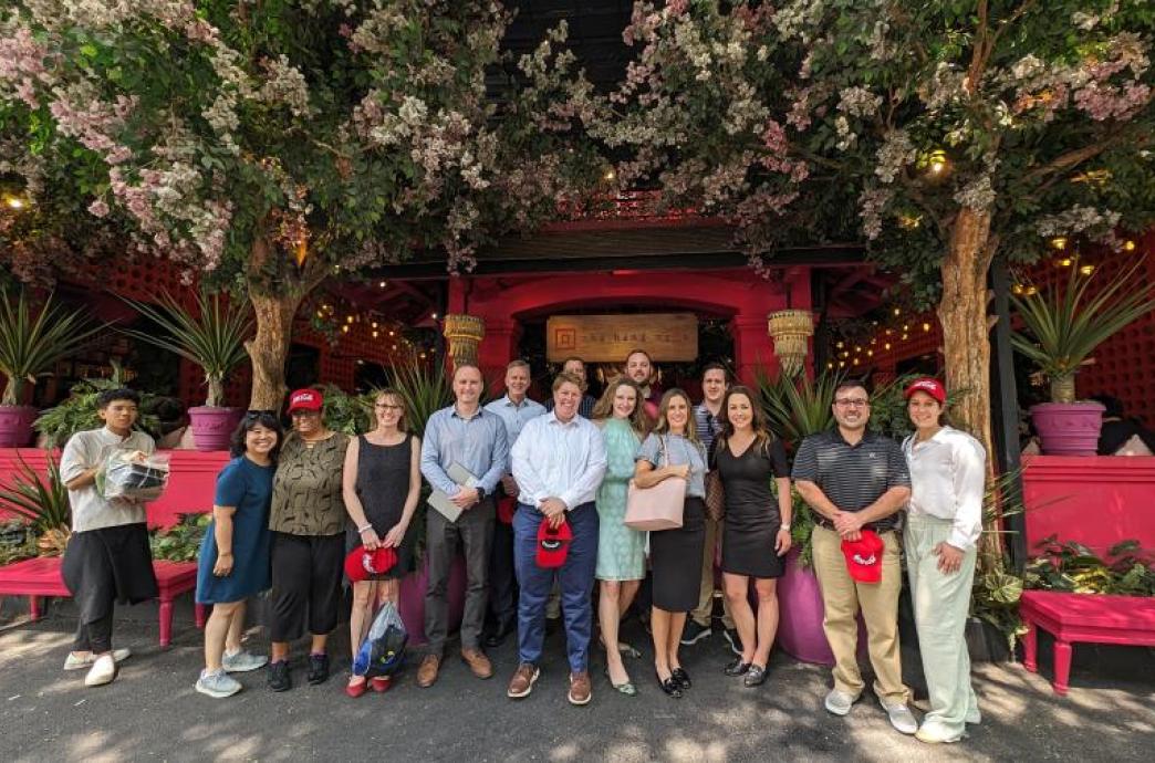 Students posing with Coca-Cola representatives during global immersion experience in Vietnam.